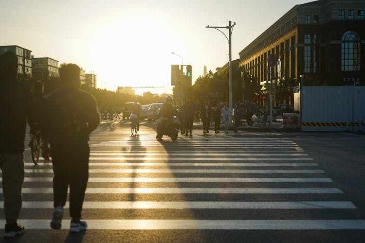 People Walking City Crossing On Sunset