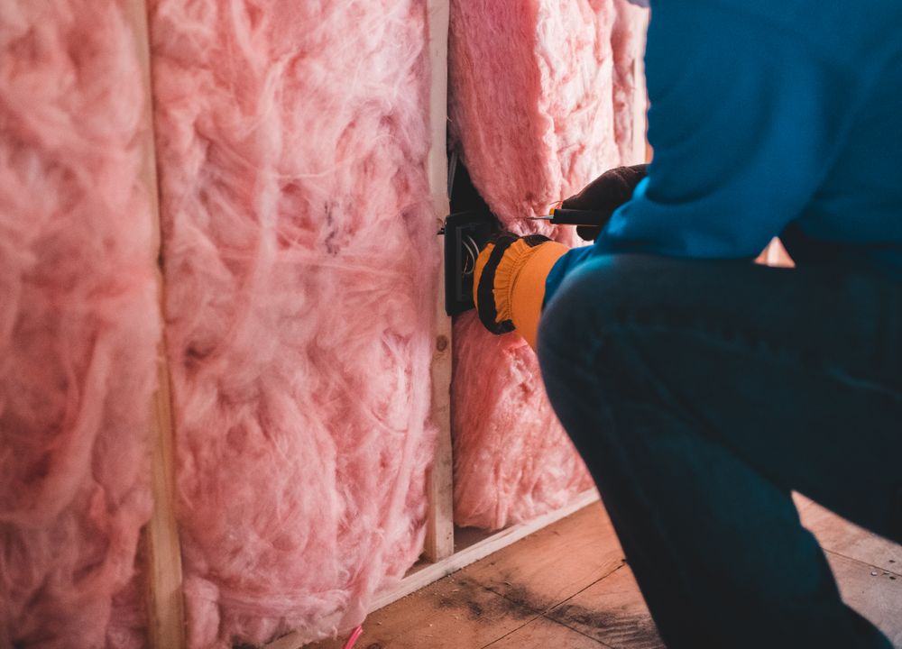 Sagging pink fiberglass insulation that needs replacing