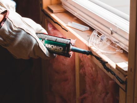 Caulking applied around a door frame