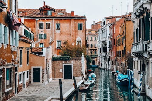 Free Street with Gondolas in City on Water Stock Photo