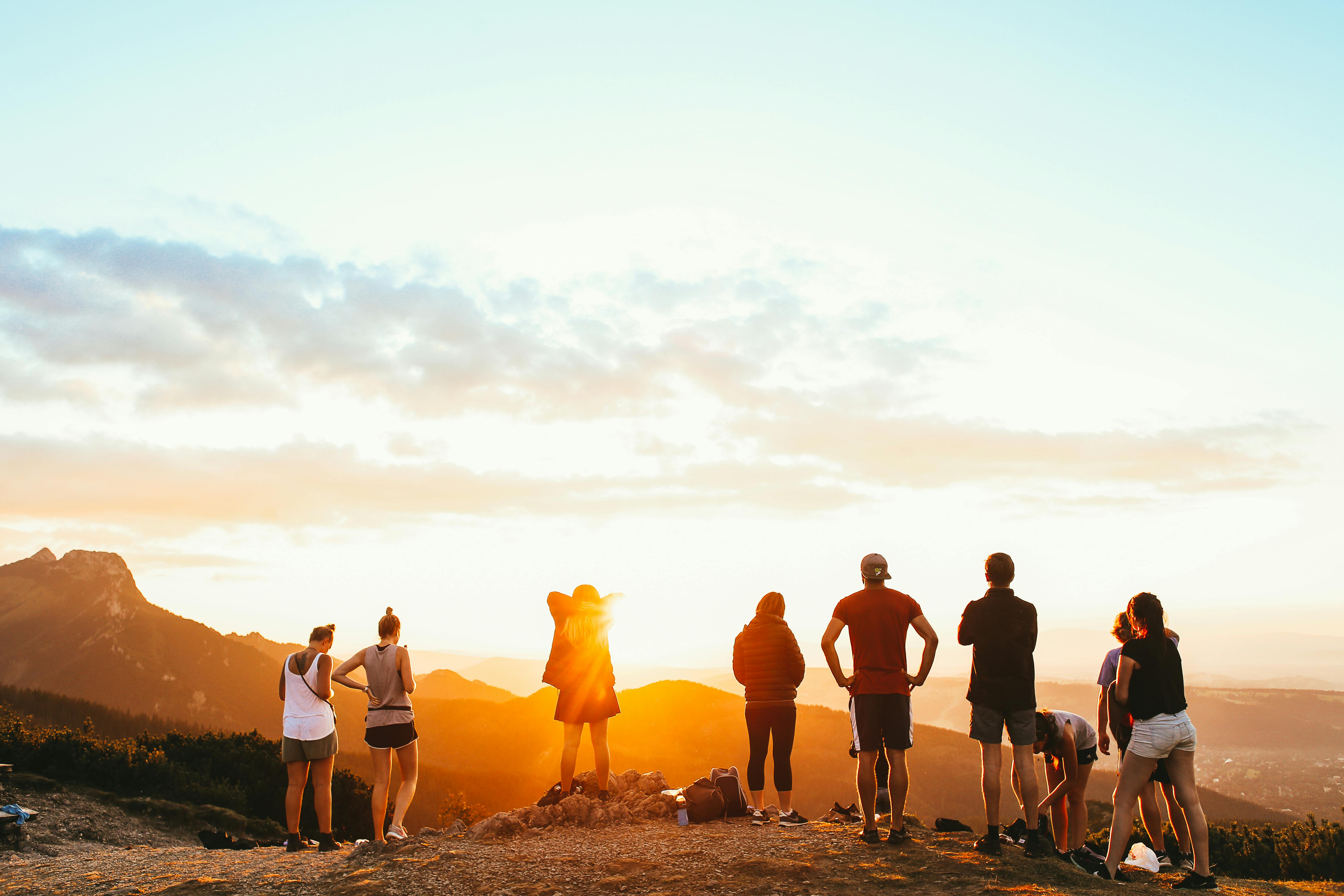 group of friends watching the sunset