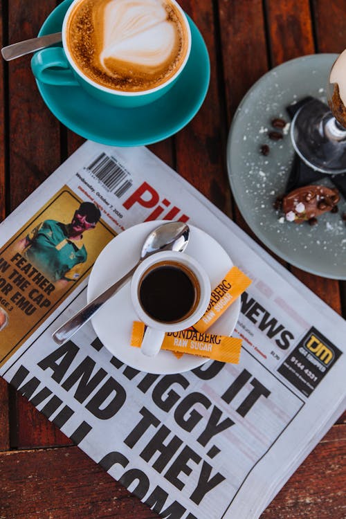 Free Coffee on Newspaper Stock Photo