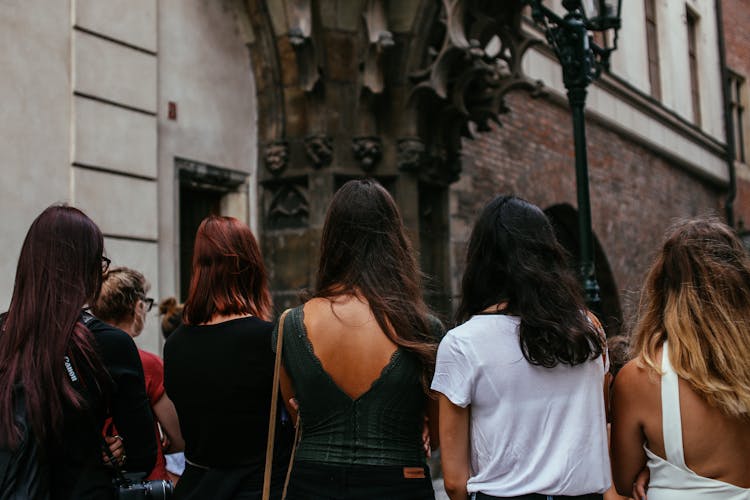 Back View Of People Outside A Building