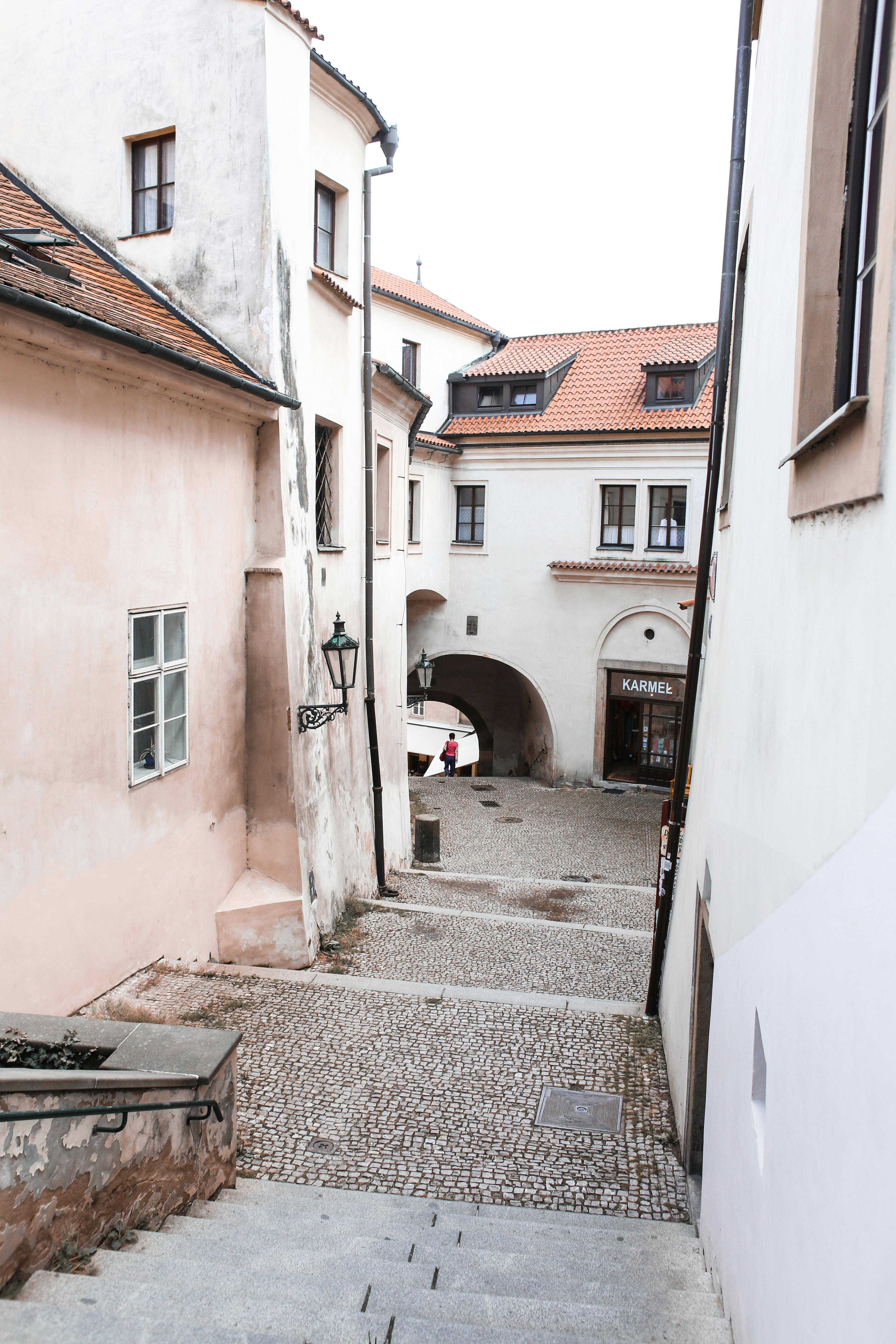 a downhill alley covered with cobblestones