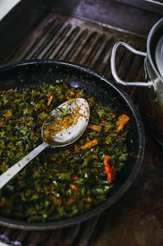 A close-up of sautéed vegetables in a frying pan, highlighting vibrant colors and textures.