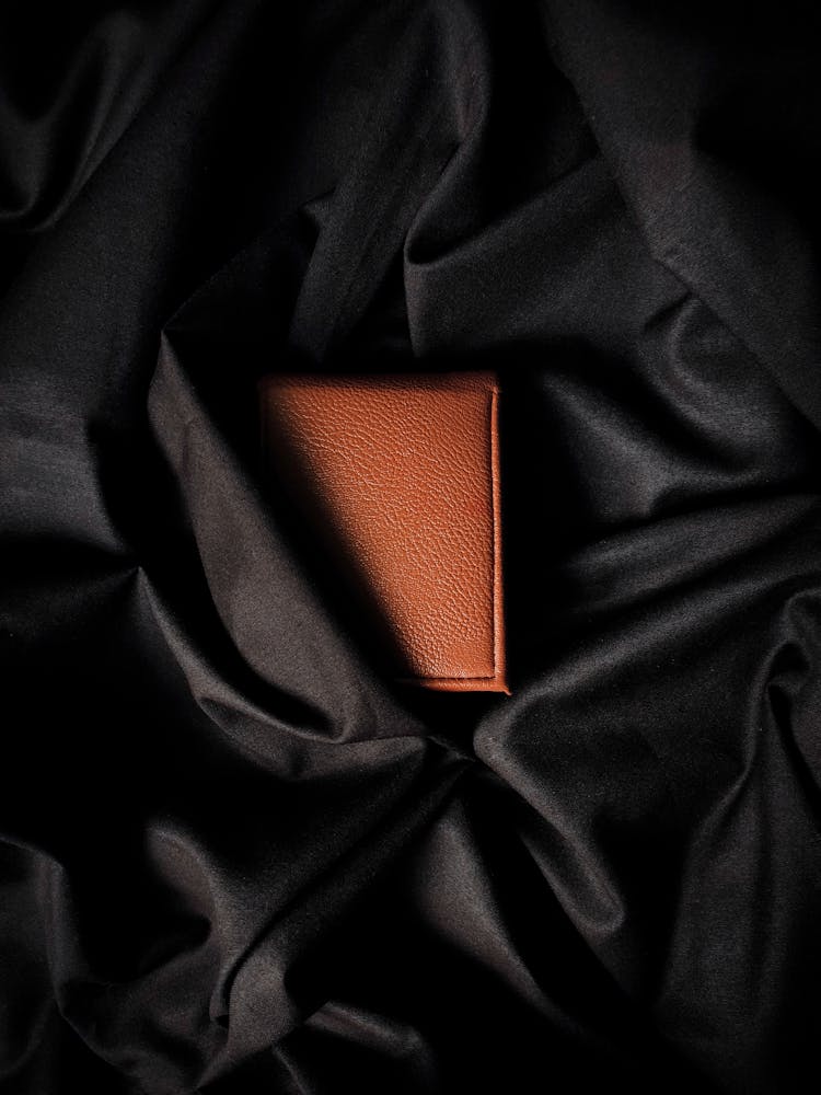 Leather Object On Black Fabric