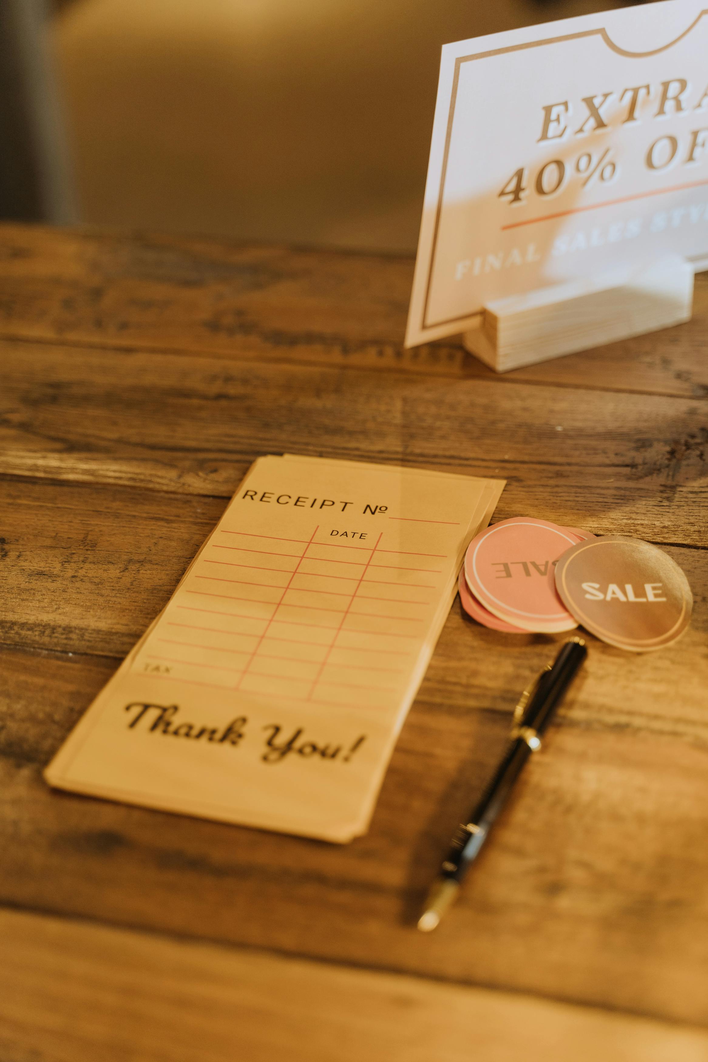 pen and cards on wooden table