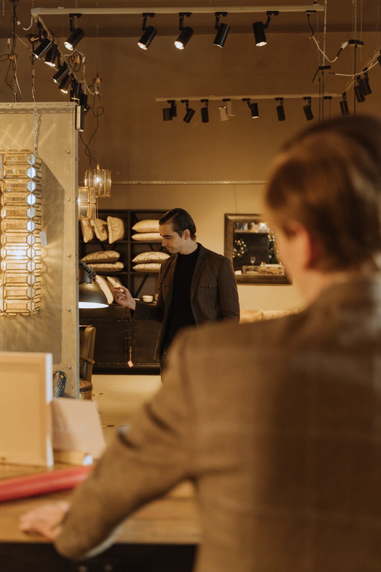 A Man Looking At Products At A Furniture Shop