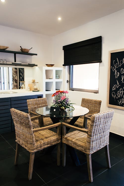 Kitchen Interior with Glass Table and Brown Woven Chairs