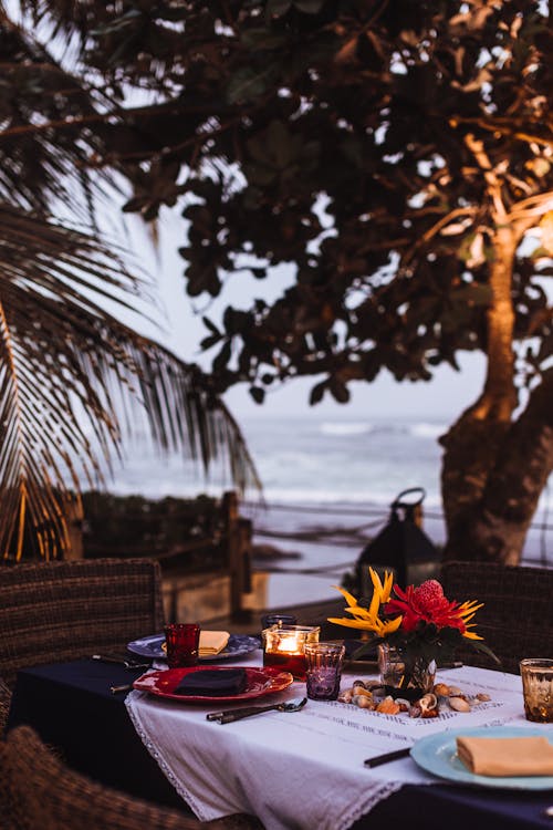 Free A Dining Table Set up by the Seaside Stock Photo