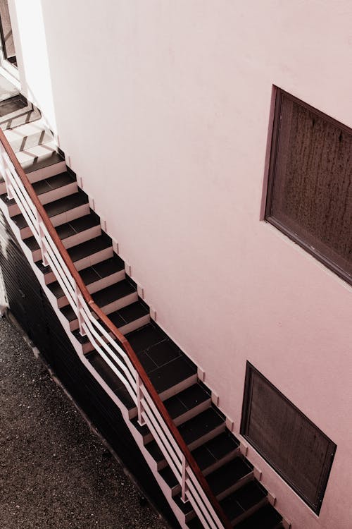 Free A Staircase With Metal Railing on a Concrete Wall Stock Photo