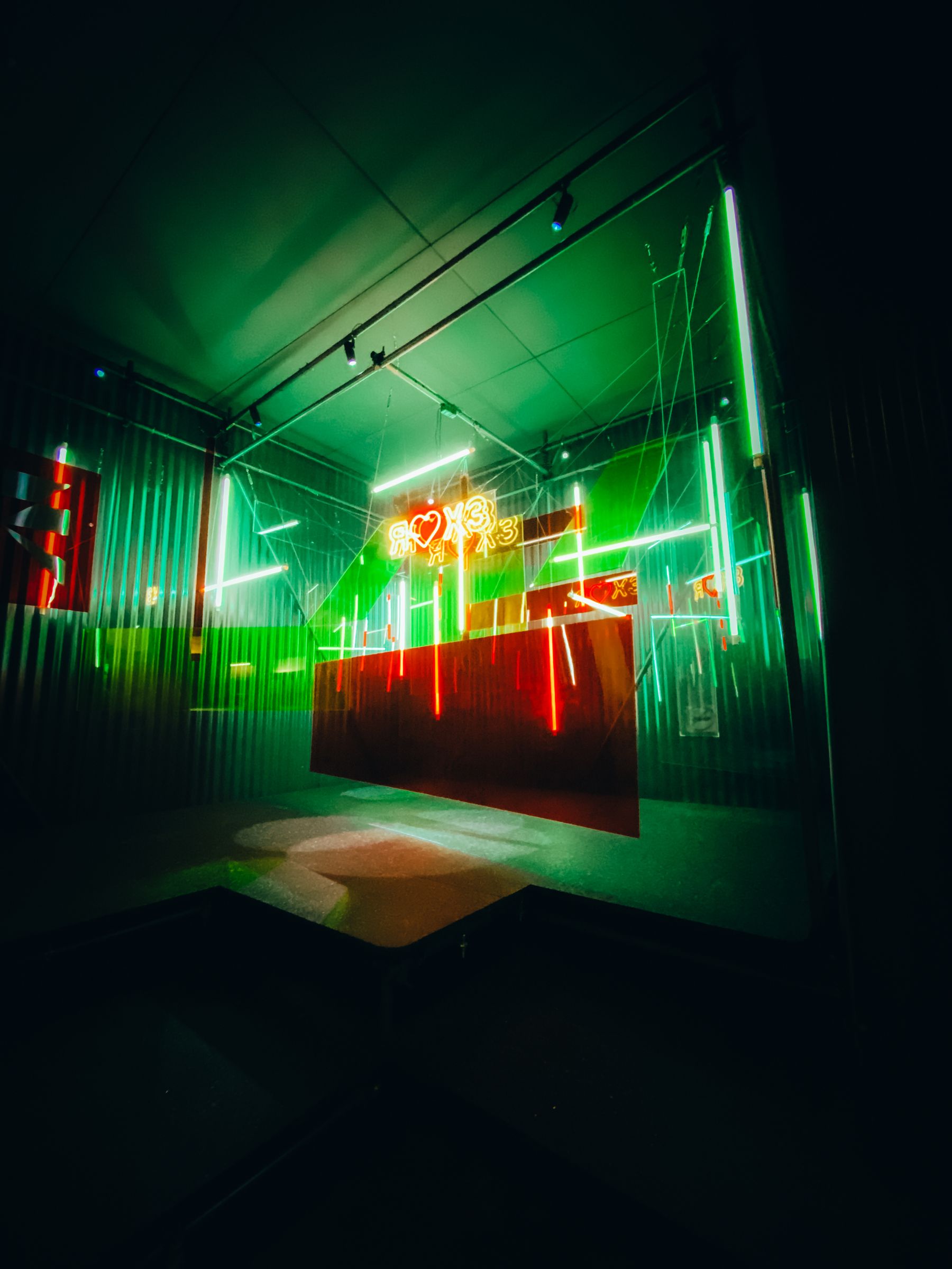 Panoramic light installation across gallery ceiling