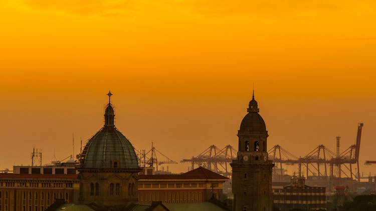 Sunset Over Churches In Town