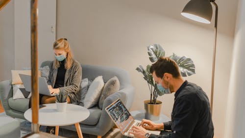 Free People Wearing Face Mask while Busy Working Stock Photo