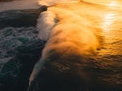 Drone Shot of Ocean Waves at Sunset