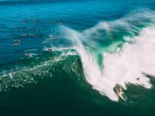 Aerial View of People Surfing on Big Waves