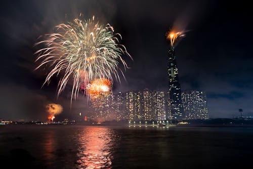 Glowing fireworks on dark sky