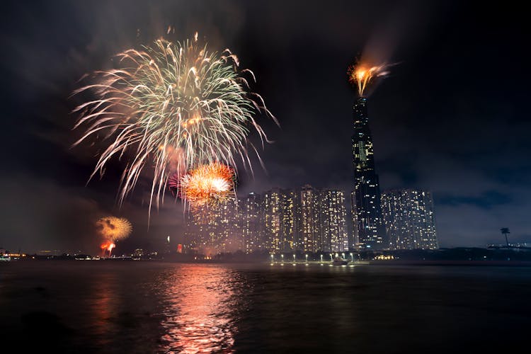 Glowing Fireworks On Dark Sky