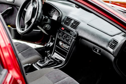 Close-Up Shot of a Black and Red Car Interior