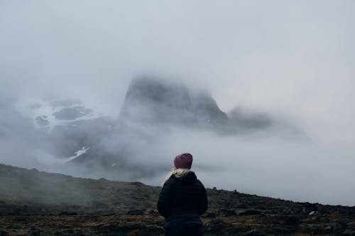 Free Back View of a Person Standing under Foggy Weather Stock Photo