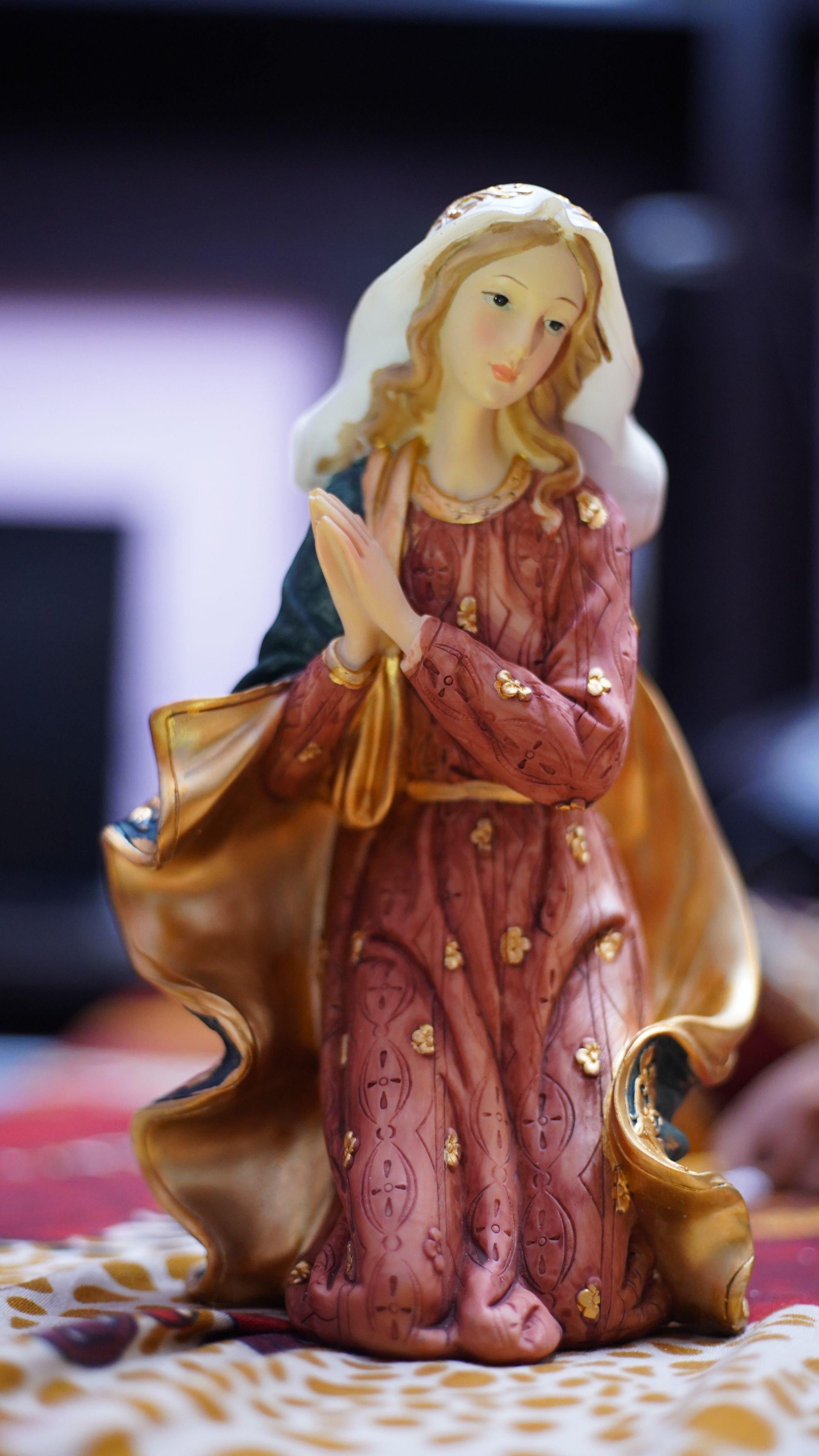 Close-up of a detailed Mother Mary figurine, symbolizing serenity and faith.