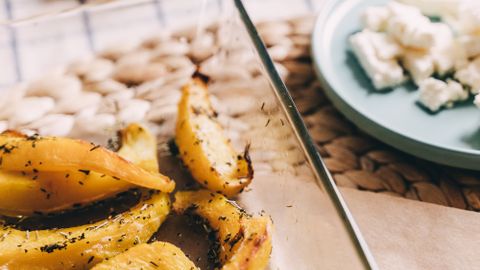 Deliciously roasted herb-seasoned potatoes in a glass dish, perfect for dinner.