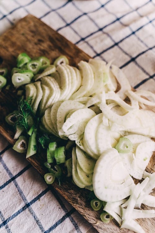 Free Sliced Fennel on Wooden Chopping Board Stock Photo