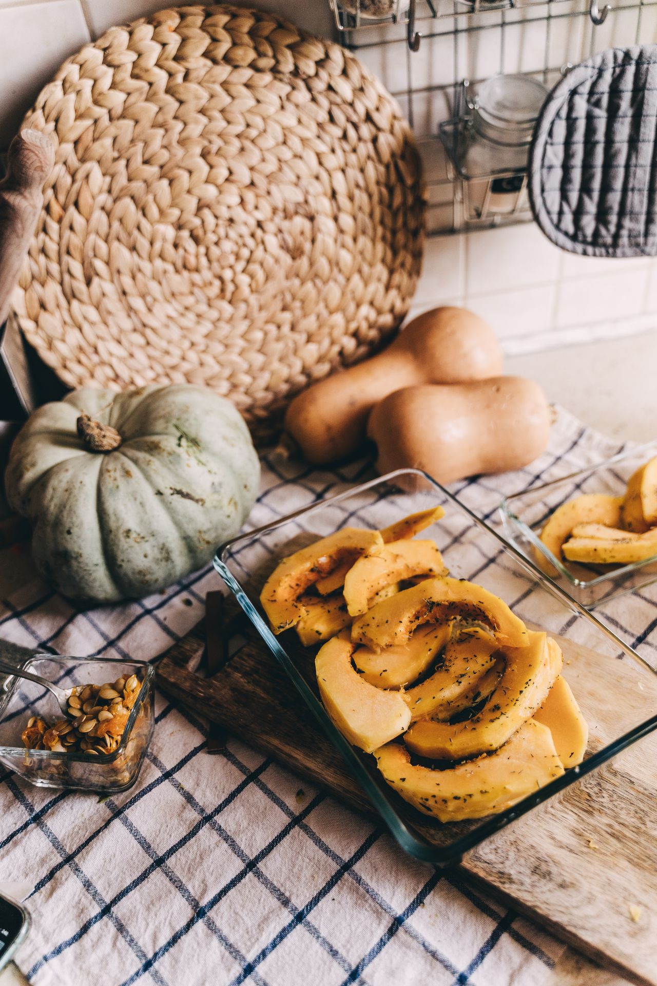 Sliced pumpkin and squash arranged on a kitchen counter, ready for cooking