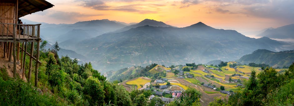 A panoramic view of the Bario highlands, showcasing the rice paddies, forests, and traditional Kelabit villages.