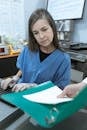 Woman Looking at a Document