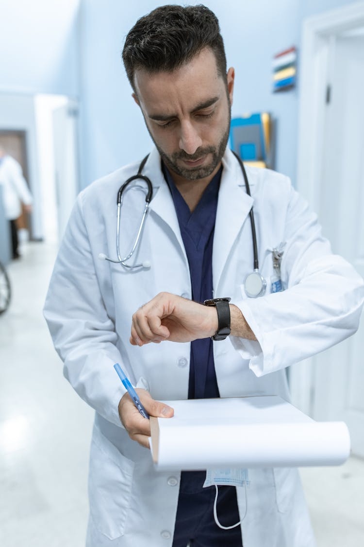 A Doctor Looking At His Watch