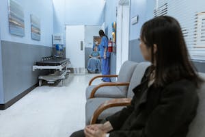 Nurse Pushing a Patient on a Wheelchair
