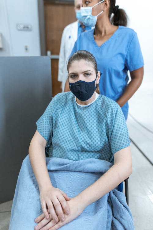 Patient on a Wheelchair Wearing a Face Mask