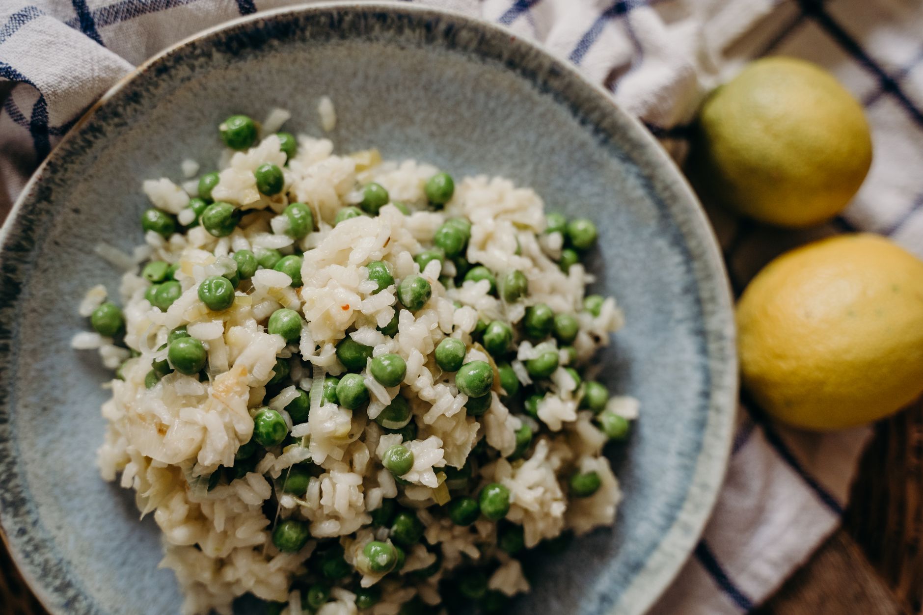 Creamy lemon orzo with greens served in bowl
