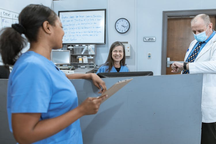 Nurses Smiling At Each Other