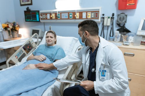 Doctor Comforting a Crying Patient