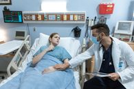 Man in Blue Button Up Shirt Sitting on Hospital Bed