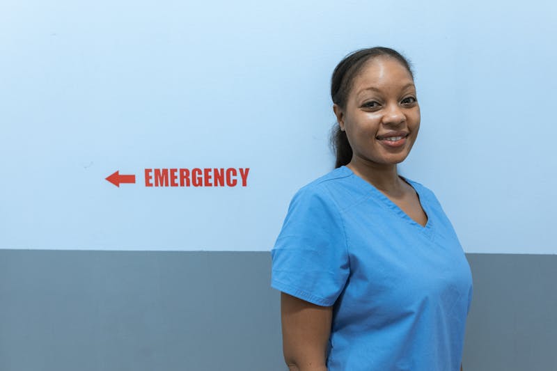 Nurse wearing scrub suit smiling