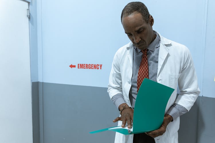 A Doctor Reading A Document