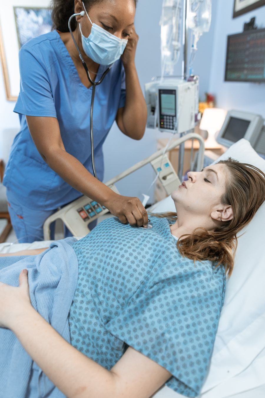 Doctor using a stethoscope during patient examination