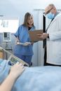 A Doctor and a Nurse Working Together in a Hospital