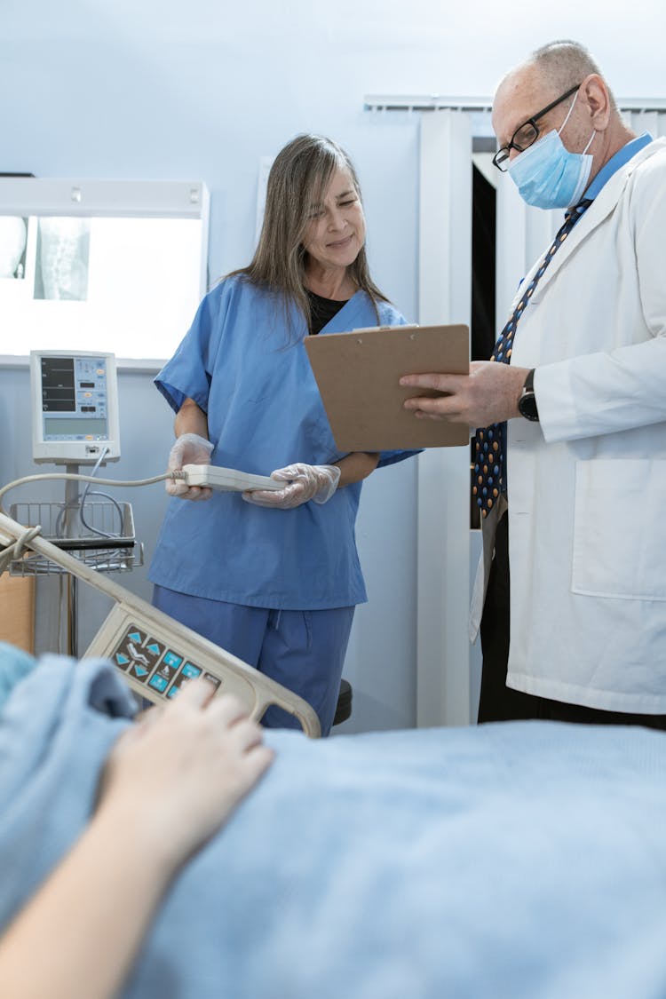 A Doctor And A Nurse Working Together In A Hospital