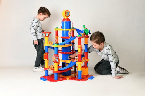 Free Young Boys playing Park Tower Toy  Stock Photo