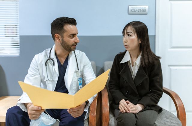 Healthcare professional consulting a patient