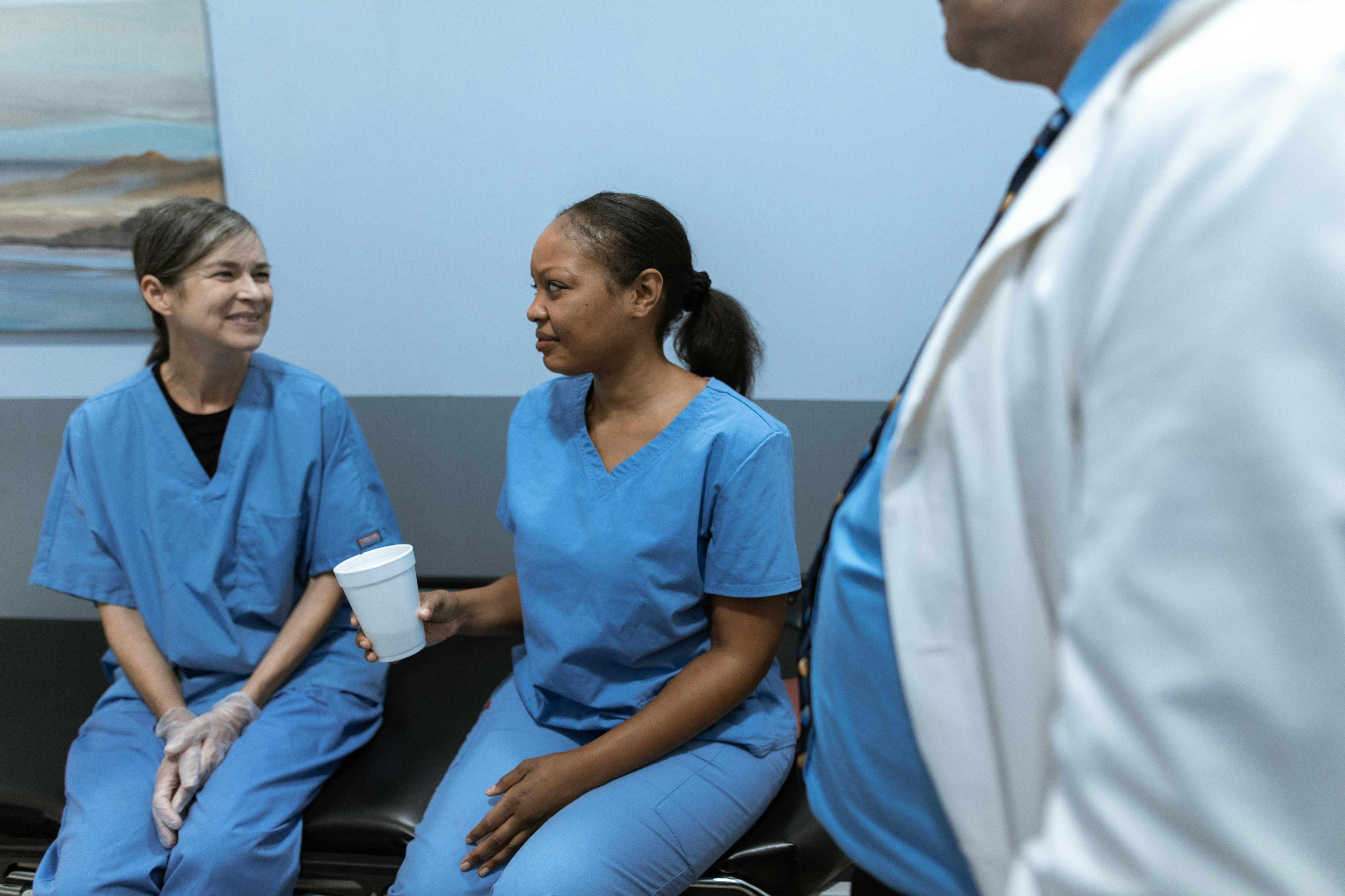 Nurses Talking While Sitting · Free Stock Photo