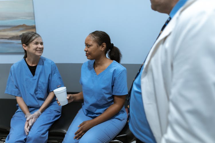 Nurses Talking While Sitting