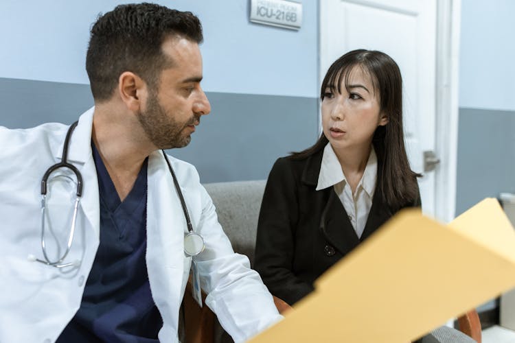 A Man Talking To A Woman