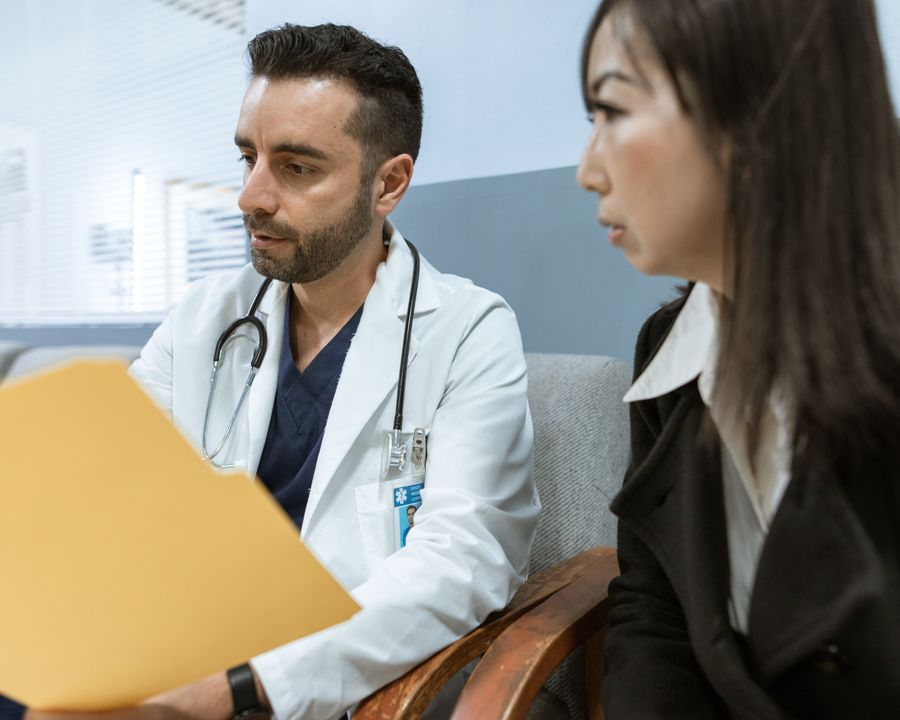 Care coordinator reviewing a treatment plan with a patient