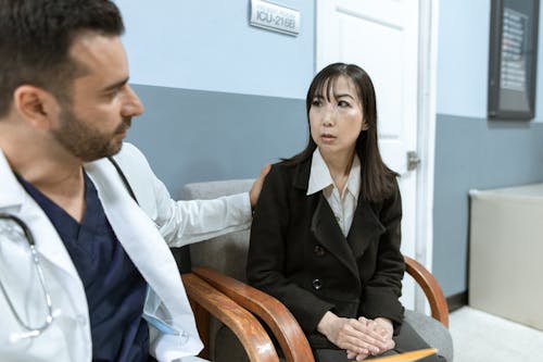 Male Doctor comforting a Patient 