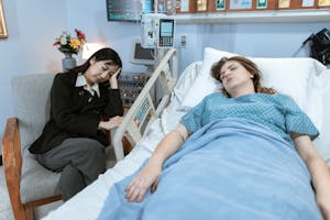 A Patient and Her Guardian Sleeping